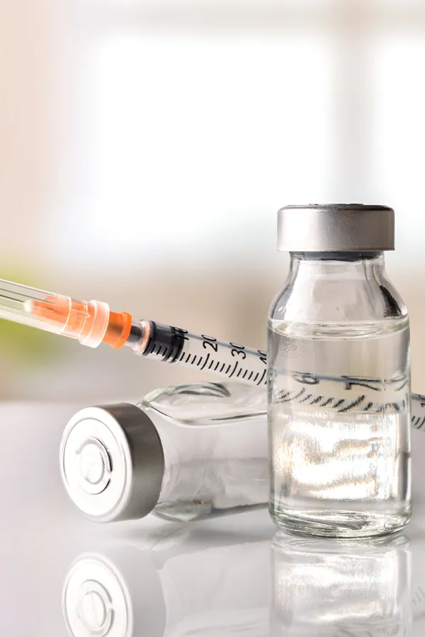 Evolysse-Fillers-Treatment Vials of dermal filler with a syringe. Get Evolysse dermal filler treatment from Brandi Terra, NP at Oak & Stone Wellness in East San Diego.