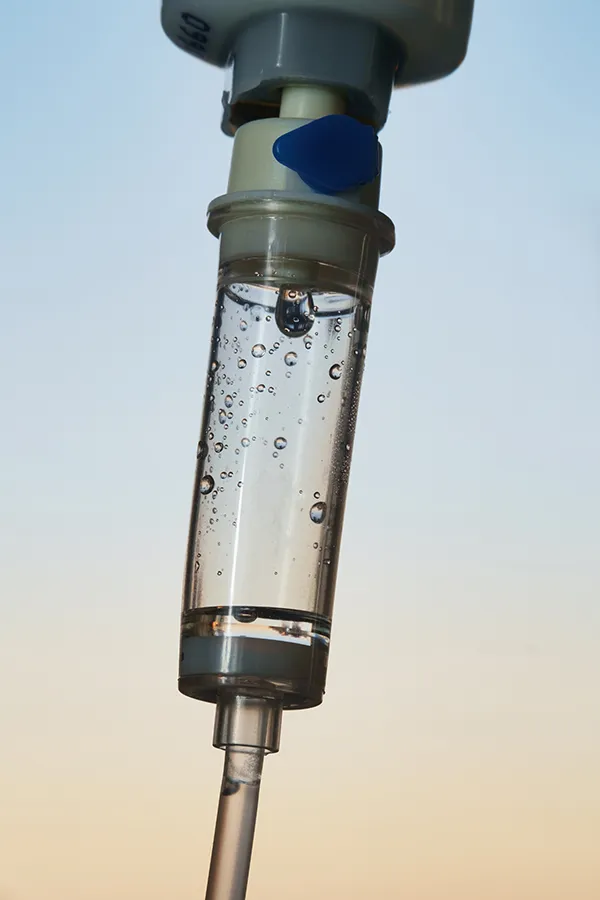 Ozone-IV-Therapy-Treatment Close-up of an IV drip. Get ozone IV therapy from Brandi Terra, NP at Oak & Stone Wellness in East San Diego.